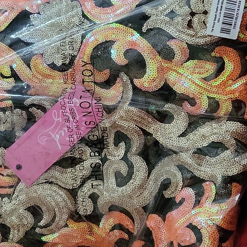 SEQUIN DUSTER,  Brand new still in packaging.